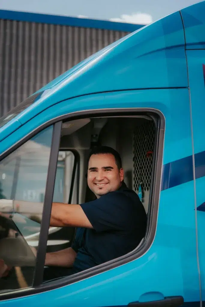 elk grove village emergency plumber in a blue van