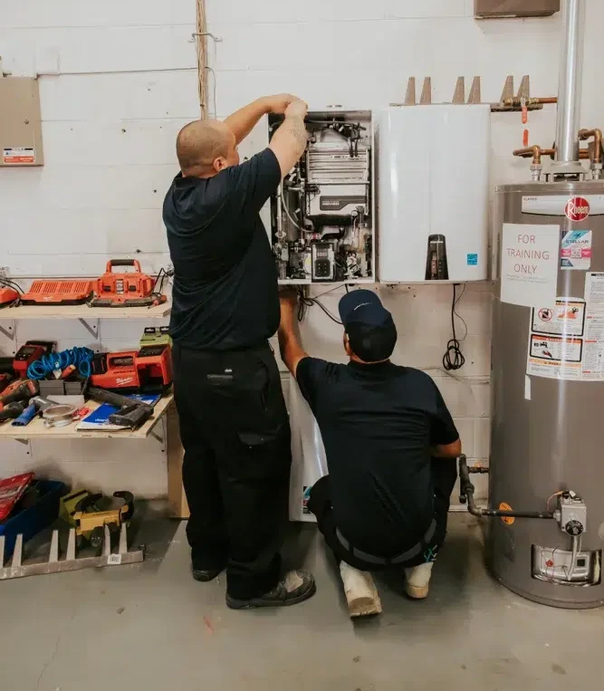 two plumbers taking care of a Schaumburg plumbing emergency