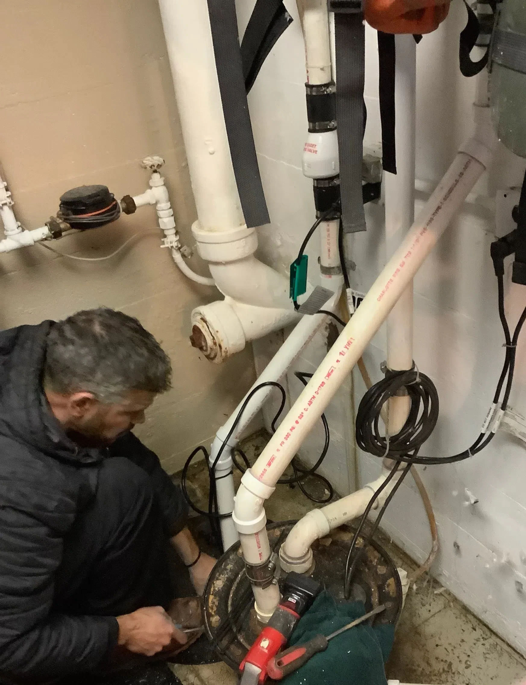 Stellar Plumbing technician working on sump pump in Elk Grove Village, IL.