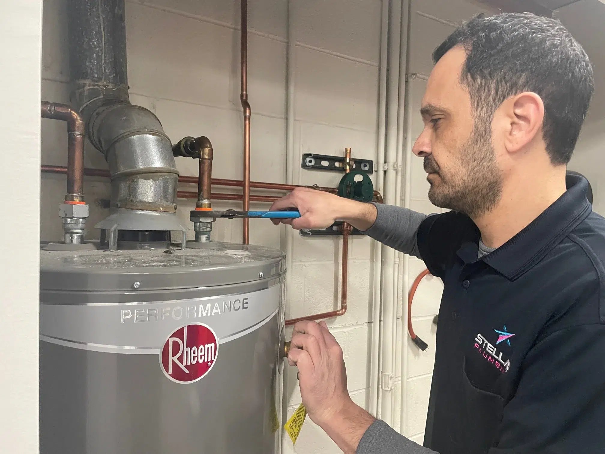 Technician repairing water heater in Elk Grove Village, IL.