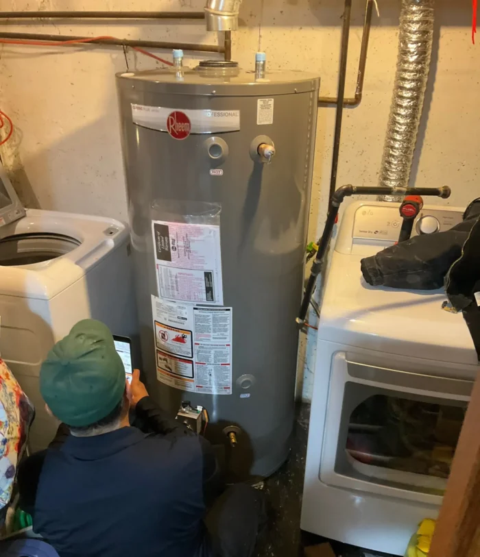 Technician repairing water heater in Elk Grove Village, IL.