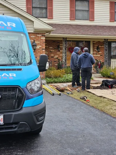 Stellar Plumbing truck and technicians outside of residential home in Elk Grove Village, IL.